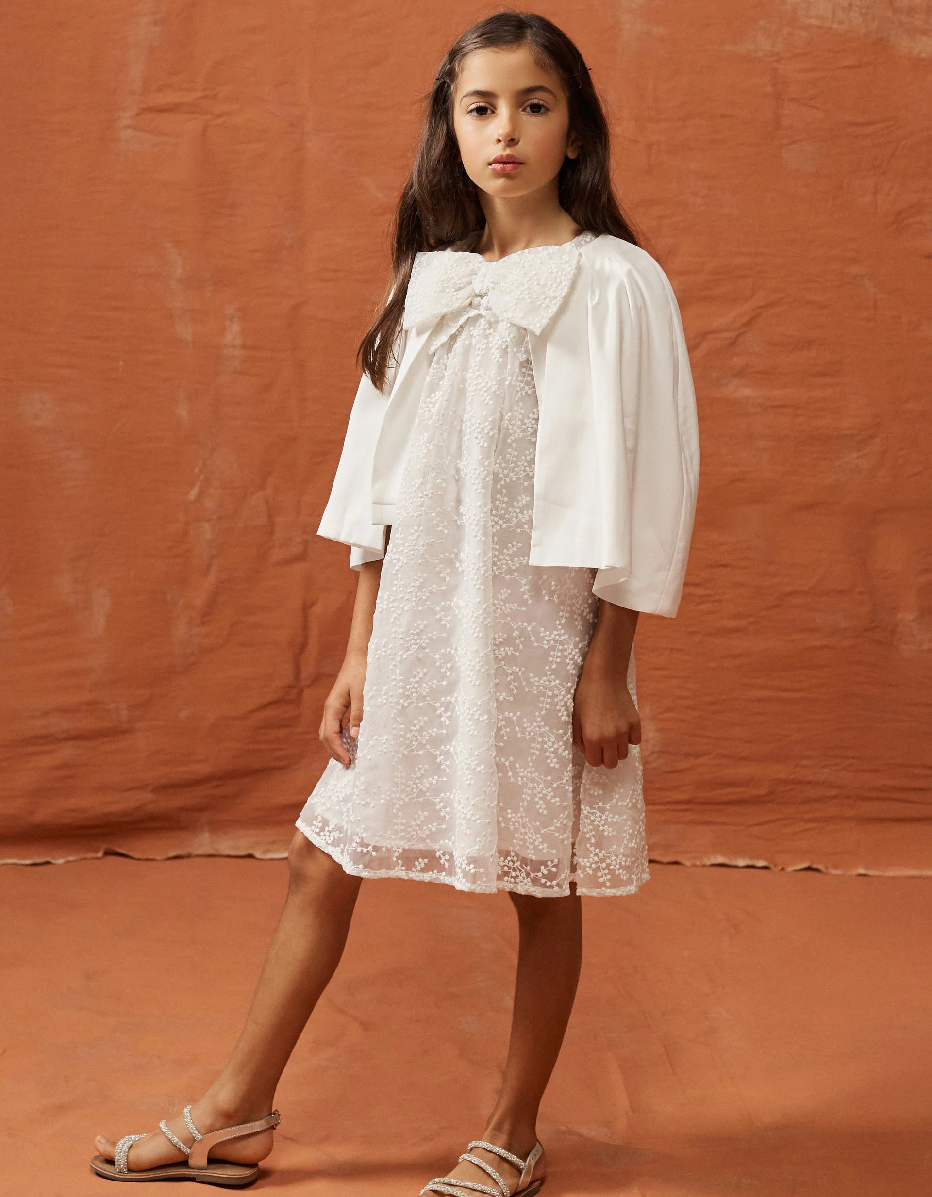 Dress with bow and ruffled cape-style sleeves for girls, white