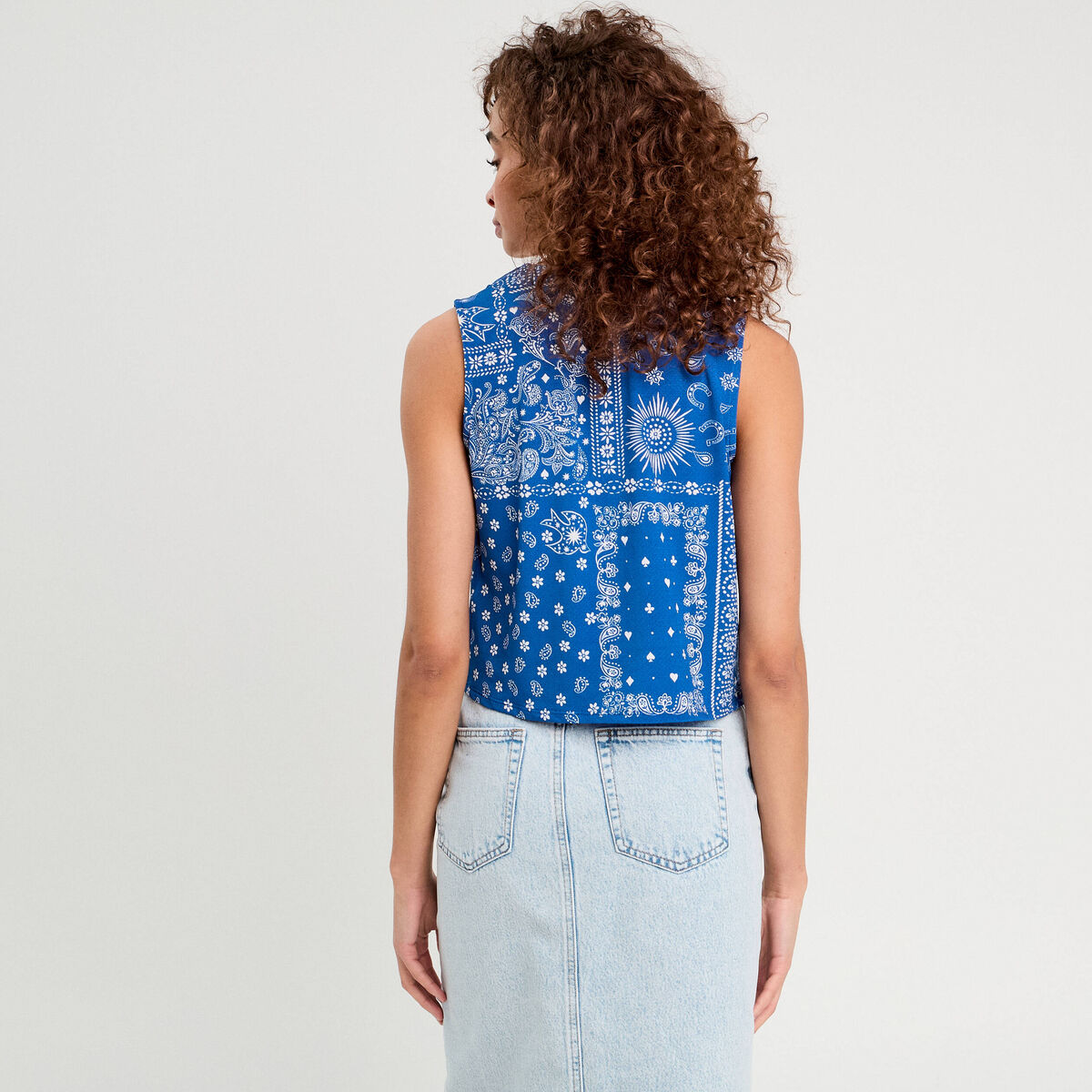 Blouse nouée sans manches bleu femme