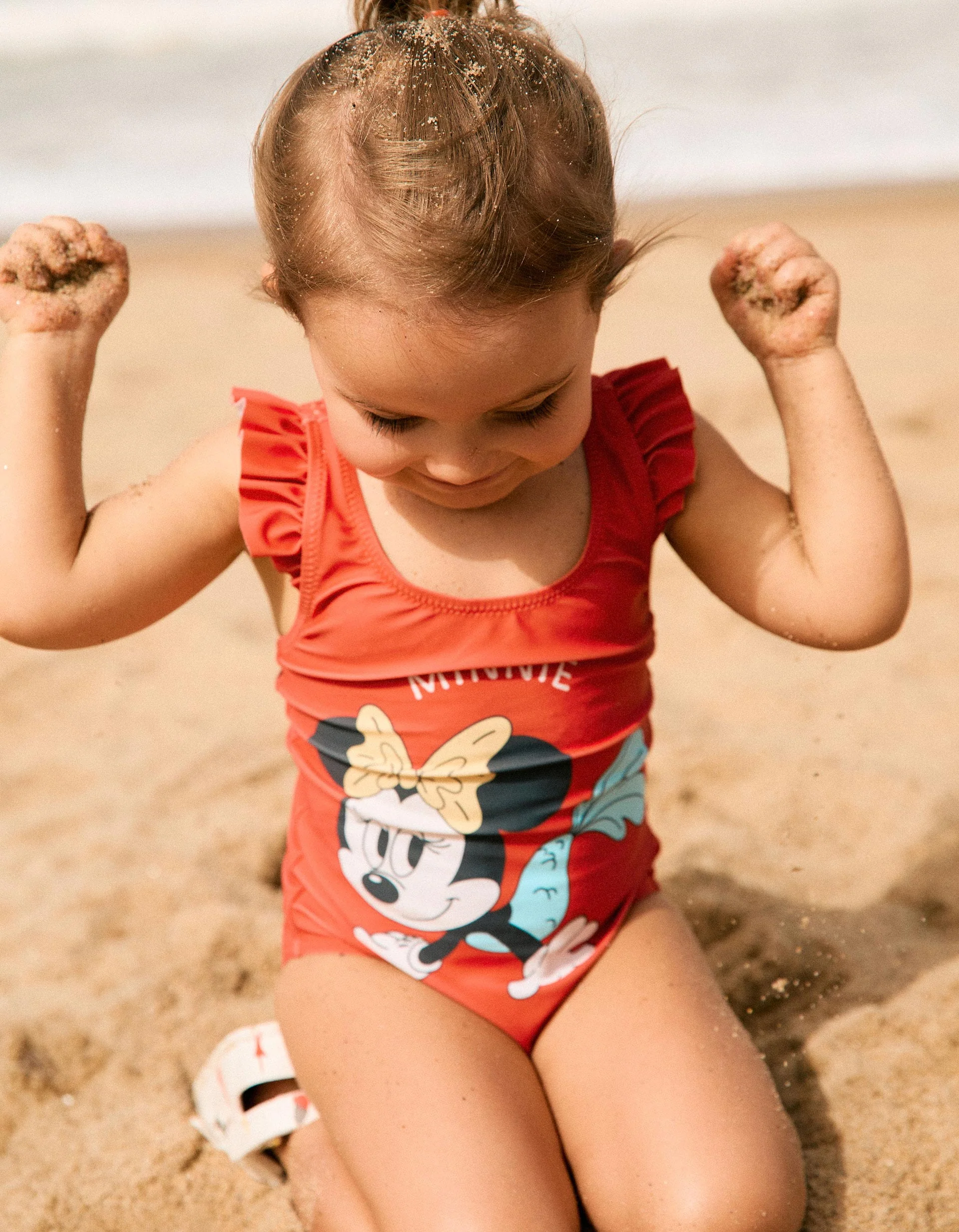 Swimsuit with Minnie print and ruffled straps for baby girls, coral