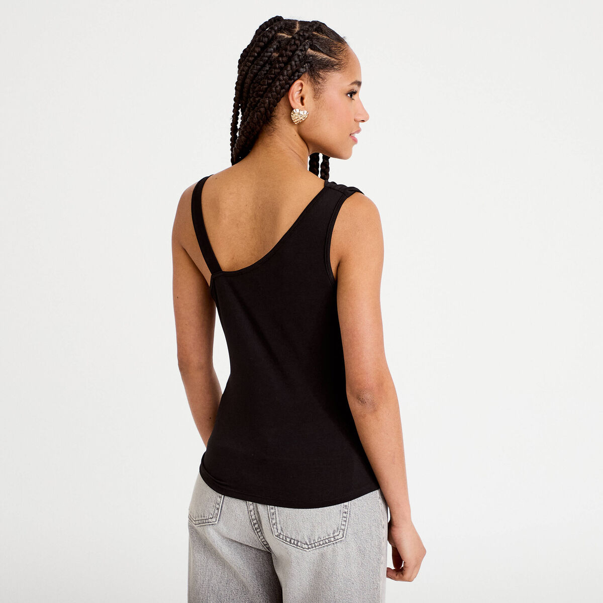 Top asymétrique avec bijou noir femme