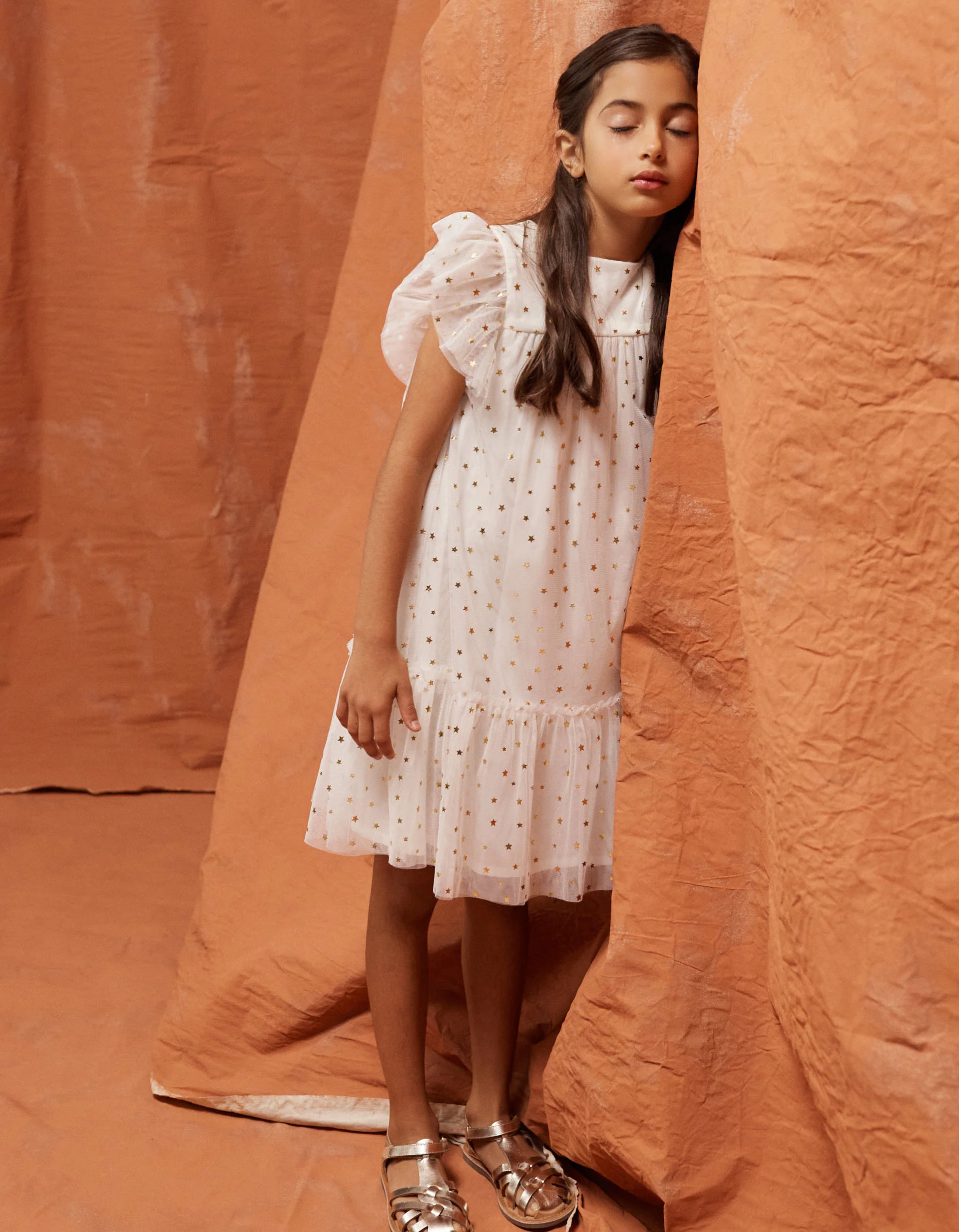 Sleeveless tulle dress with ruffles and stars for girls, white