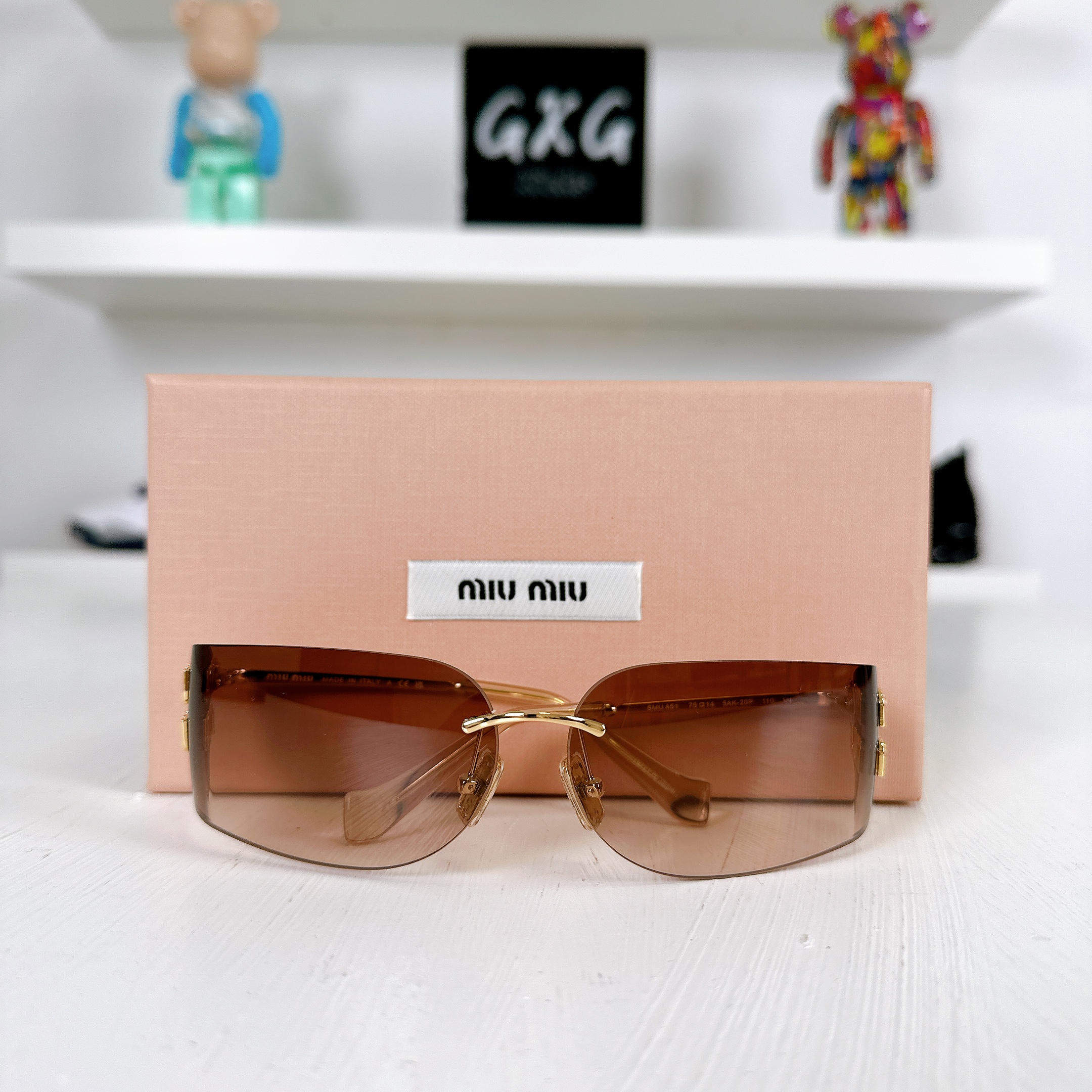 Miu Miu Frameless Sunglasses Gold