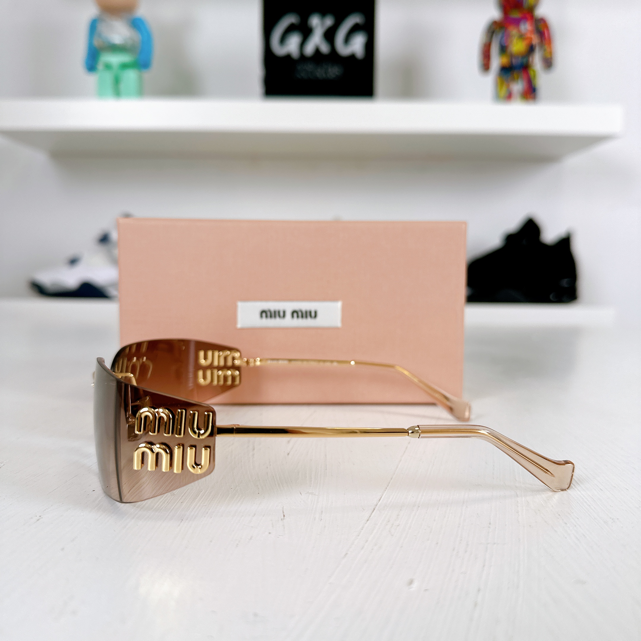 Miu Miu Frameless Sunglasses Gold
