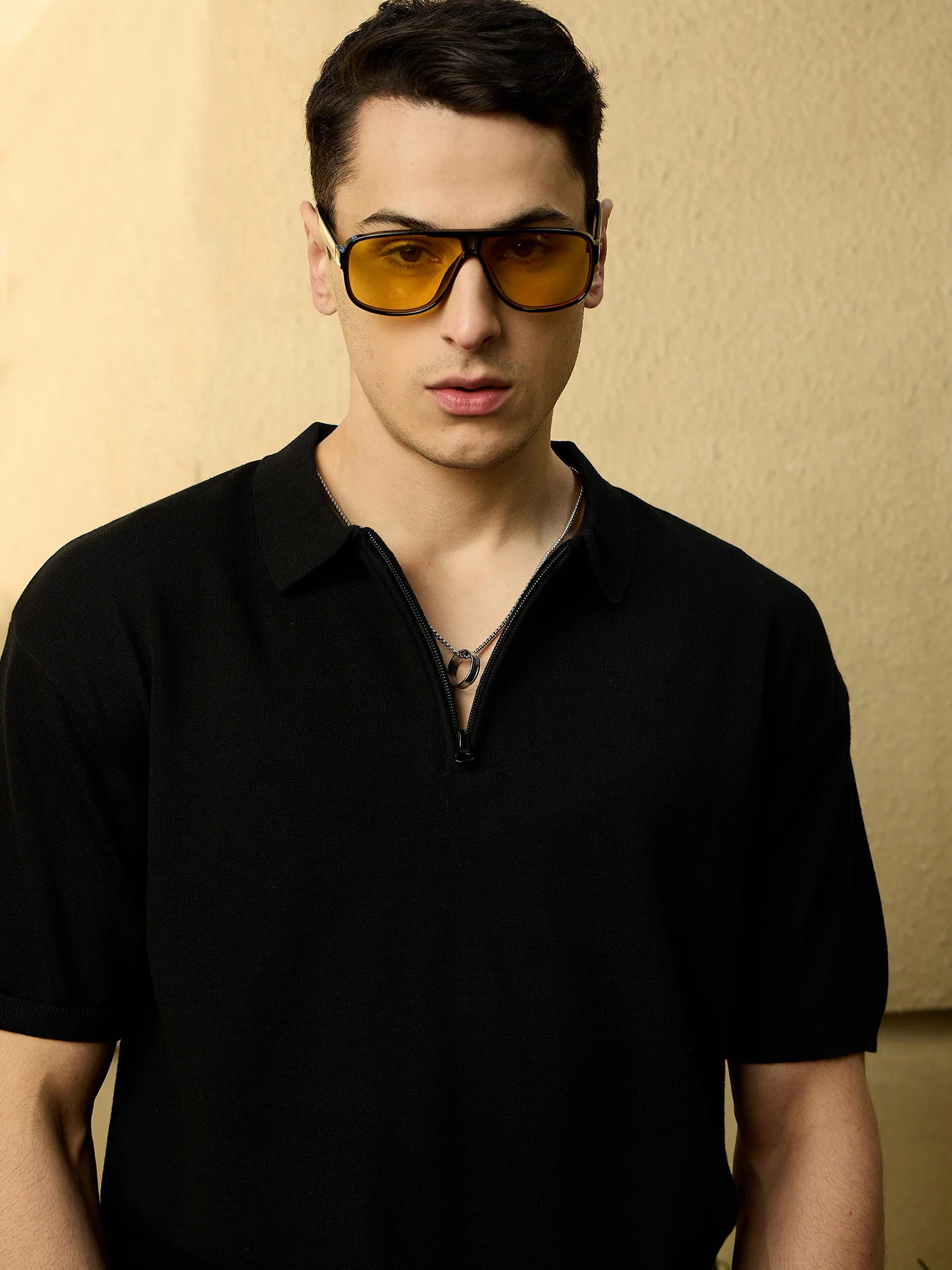 Black: Relaxed Zipped Polo T-Shirt