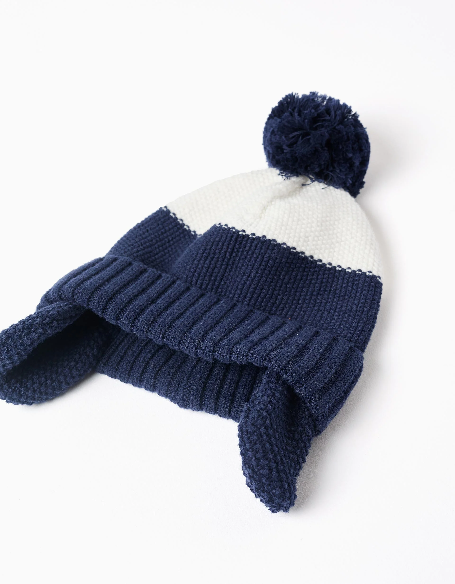 Beanie with pompom and ear protection for newborn boys, blue/white